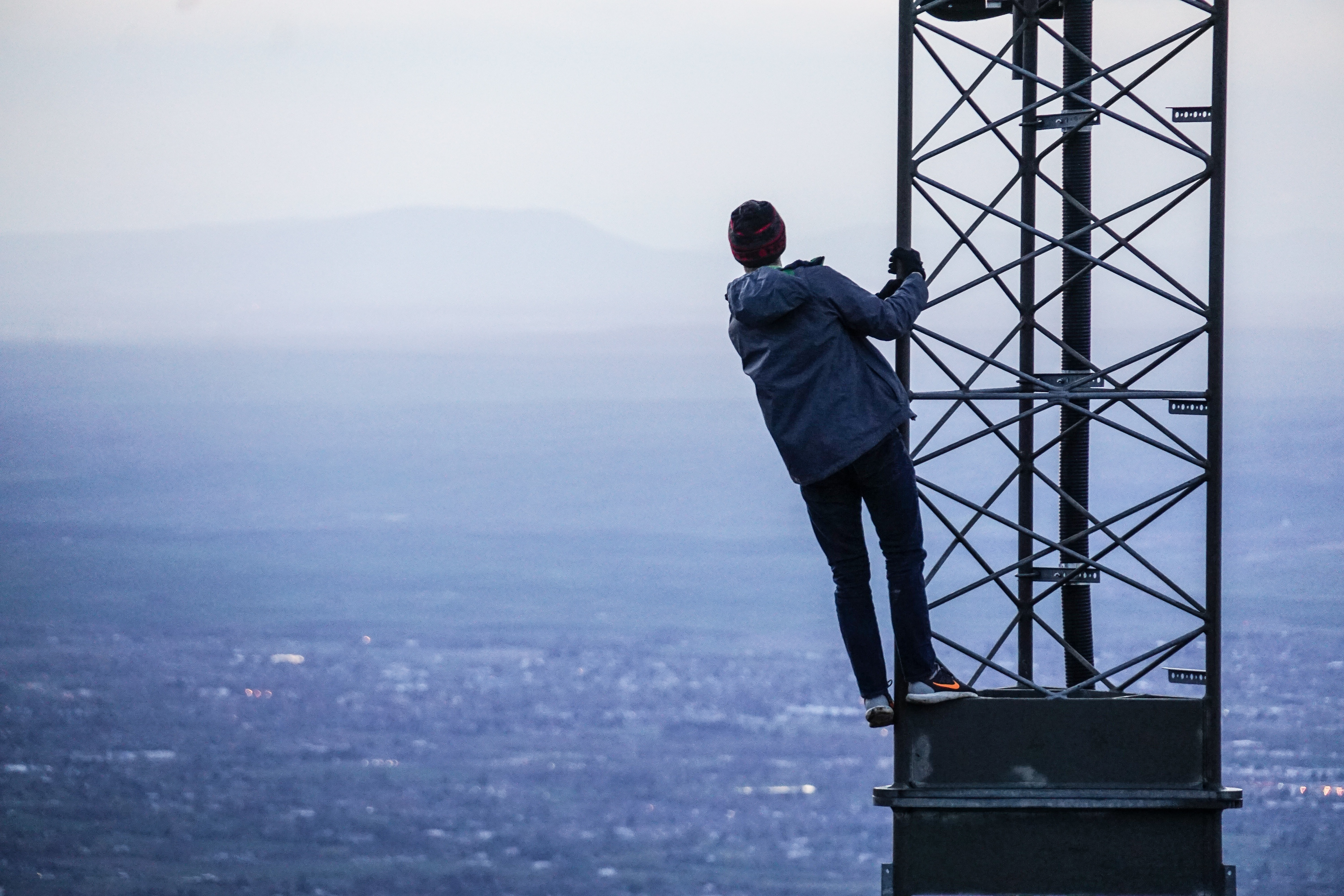 guy looking from a tower